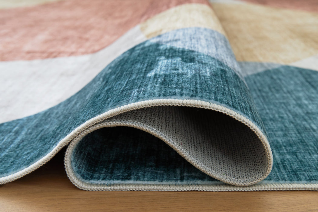 Chanleigh Washable 7'6" x 9'6" Area Rug - Furniture Land (Milwaukee, WI)